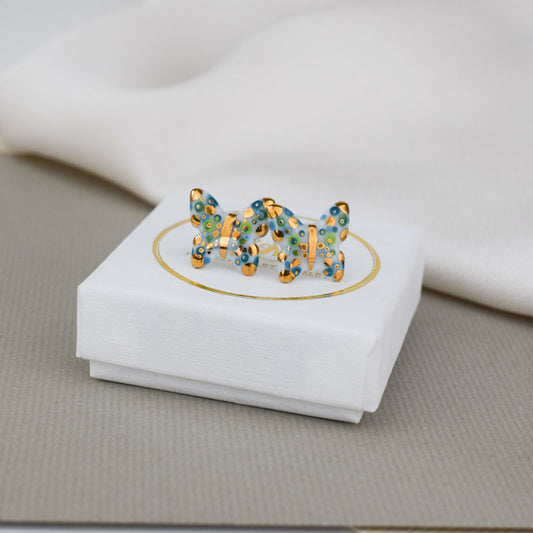 Porcelain stud earrings created and hand-painted by Vali Bondoc with high temperature ceramic dyes and colloidal gold