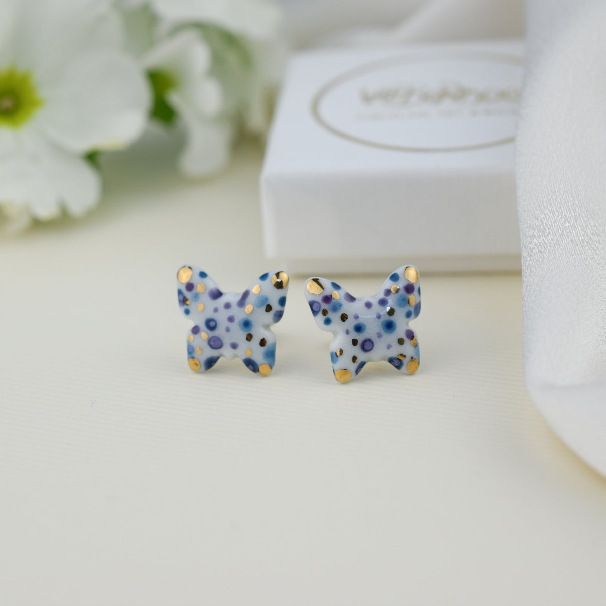 Butterfly. Porcelain stud earrings created and hand-painted by Vali Bondoc with high temperature ceramic dyes and colloidal gold