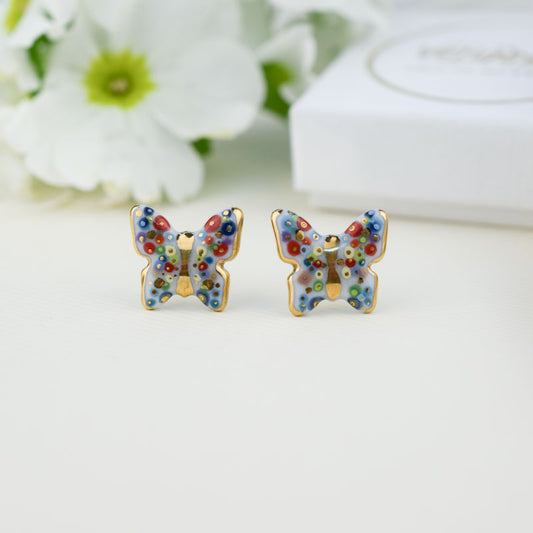 Butterfly. Porcelain stud earrings created and hand-painted by Vali Bondoc with high temperature ceramic dyes and colloidal gold